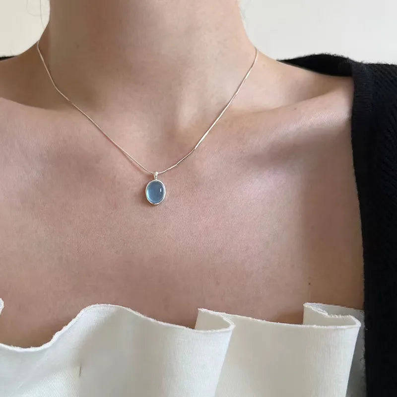 Stylish Simplicity: Silver Oval Aquamarine Pendant Necklace by VOQ