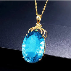 Elegance in Gold: 24K Gold Plated Oval Aquamarine Pendant Necklace with Cubic Topaz