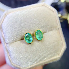 YULEM Sparkle: Sterling Silver Oval Cut Emerald Stud Earrings (5x7mm)