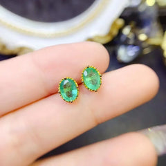 YULEM Sparkle: Sterling Silver Oval Cut Emerald Stud Earrings (5x7mm)