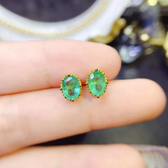 YULEM Sparkle: Sterling Silver Oval Cut Emerald Stud Earrings (5x7mm)