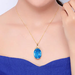 Elegance in Gold: 24K Gold Plated Oval Aquamarine Pendant Necklace with Cubic Topaz